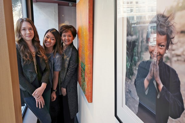 From left to right: Lauren Davis, Clarissa Gines, and Cora Edmonds at ArtXchange Gallery. • Photo by Dean Wong